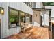 Welcoming porch area featuring a wooden bench, stylish lighting, and views of the surrounding greenery at 4290 Inverness Ne Ct, Roswell, GA 30075