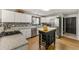 Bright kitchen with stainless steel appliances, speckled granite countertops, and a functional central island at 4290 Inverness Ne Ct, Roswell, GA 30075