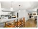 Open kitchen with granite countertops, stainless steel appliances and an island with seating at 4290 Inverness Ne Ct, Roswell, GA 30075