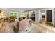 Comfortable living room with wood flooring, an area rug, and a view into the wet bar at 4290 Inverness Ne Ct, Roswell, GA 30075
