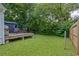 Spacious backyard with a deck, seating, grill, and plenty of green space for outdoor activities at 439 Atlanta Se Ave, Atlanta, GA 30315