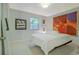 Bright bedroom features neutral walls, carpet and an abstract art piece at 439 Atlanta Se Ave, Atlanta, GA 30315