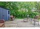 Wooden deck with outdoor seating, surrounded by lush greenery and a shed at 439 Atlanta Se Ave, Atlanta, GA 30315
