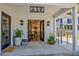Inviting entryway with a glimpse of a modern kitchen, stylish lighting, and beautiful potted plants at 439 Atlanta Se Ave, Atlanta, GA 30315