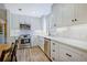 Updated kitchen with stainless steel appliances, white marble countertops, and custom cabinetry at 439 Atlanta Se Ave, Atlanta, GA 30315