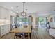 Bright kitchen with white cabinets, stainless appliances, and an open layout to the dining and living areas at 439 Atlanta Se Ave, Atlanta, GA 30315