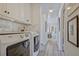 Laundry room features modern washer and dryer with storage cabinets at 439 Atlanta Se Ave, Atlanta, GA 30315