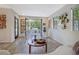 Bright living room featuring French doors opening to a patio with modern decor and hardwood floors at 439 Atlanta Se Ave, Atlanta, GA 30315