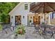 Charming outdoor patio with iron furniture, vibrant flowers, and view of home's exterior at 439 Atlanta Se Ave, Atlanta, GA 30315