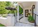 Inviting covered porch with stylish lighting, beautiful potted plants, and stone landscaping at 439 Atlanta Se Ave, Atlanta, GA 30315