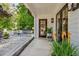 Charming covered porch with stylish lighting, inviting entrance, and beautiful potted plants at 439 Atlanta Se Ave, Atlanta, GA 30315