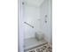 Bathroom shower featuring white subway tile, a built-in seat and grab bars at 439 Atlanta Se Ave, Atlanta, GA 30315