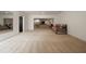 Open basement area featuring neutral carpet, a daybed and open access to a secondary living area with comfortable couches at 633 Channing Nw Dr, Atlanta, GA 30318