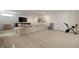 Spacious basement featuring neutral carpet, entertainment center, and modern decor at 633 Channing Nw Dr, Atlanta, GA 30318