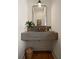 Stylish powder room featuring a concrete sink, modern faucet, and sleek mirror at 633 Channing Nw Dr, Atlanta, GA 30318