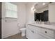 Modern bathroom features a marble vanity, hexagon floor tiles, and tiled shower at 633 Channing Nw Dr, Atlanta, GA 30318