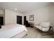 Contemporary bedroom offering a workspace with a desk, a comfortable chair, a bed and a wall art piece at 633 Channing Nw Dr, Atlanta, GA 30318