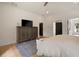 Bright bedroom featuring hardwood floors, large dresser, ceiling fan, and modern style at 633 Channing Nw Dr, Atlanta, GA 30318