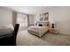 Cozy bedroom with a work desk and chair, complemented by a comfortable bed and neutral decor for a relaxing ambiance at 633 Channing Nw Dr, Atlanta, GA 30318