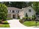 Charming two-story home boasts a two-car garage and landscaped yard at 633 Channing Nw Dr, Atlanta, GA 30318