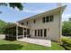 Rear view of the home featuring a patio, screened in porch, and white siding at 633 Channing Nw Dr, Atlanta, GA 30318