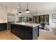 Spacious kitchen with a large island, stainless steel appliances, and an open dining area at 633 Channing Nw Dr, Atlanta, GA 30318