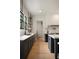 Well-appointed kitchen featuring dark cabinets, open shelving, and stainless steel appliances at 633 Channing Nw Dr, Atlanta, GA 30318