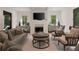 Bright and airy living room with neutral tones, a fireplace, and hardwood floors at 633 Channing Nw Dr, Atlanta, GA 30318