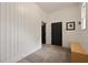 Inviting mudroom with vertical wood paneling, stone floors, and a built-in bench for convenient storage at 633 Channing Nw Dr, Atlanta, GA 30318