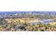 Lovely aerial view of a golf course, pond, and a sprawling city skyline in the background at 795 Hammond Dr # 808, Sandy Springs, GA 30328