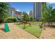 Spacious dog park with play equipment and seating areas within a fenced enclosure at 795 Hammond Dr # 808, Sandy Springs, GA 30328
