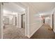 Building hallway with elevators, gray carpet, white walls, and neutral trim at 795 Hammond Dr # 808, Sandy Springs, GA 30328
