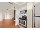 Open concept kitchen with stainless appliances, hardwood floors and lots of cabinet space at 795 Hammond Dr # 808, Sandy Springs, GA 30328