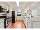 Clean kitchen with stainless steel appliances, granite countertops, and hardwood floors at 795 Hammond Dr # 808, Sandy Springs, GA 30328