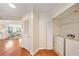 Bright laundry area with updated washer and dryer, plus hardwood floors at 795 Hammond Dr # 808, Sandy Springs, GA 30328