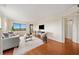 Open-concept living space featuring hardwood floors, natural light, and access to outdoor balcony at 795 Hammond Dr # 808, Sandy Springs, GA 30328