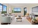 Inviting living room boasts natural light, comfortable seating, and scenic views through large windows at 795 Hammond Dr # 808, Sandy Springs, GA 30328
