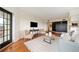 Well-designed living room with dark wood accents, hardwood floors, and comfortable seating arrangements at 795 Hammond Dr # 808, Sandy Springs, GA 30328