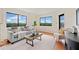 Relaxing living room showcasing a comfortable sofa, scenic views, and a neutral color scheme at 795 Hammond Dr # 808, Sandy Springs, GA 30328