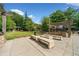 Outdoor recreation area with benches, barbecue grills and shaded structures for community gatherings at 795 Hammond Dr # 808, Sandy Springs, GA 30328