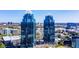 A pair of sleek skyscrapers in an urban setting, complemented by surrounding trees at 795 Hammond Dr # 808, Sandy Springs, GA 30328