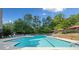 Beautiful swimming pool with lounge chairs, mature trees and shade canopies at 795 Hammond Dr # 808, Sandy Springs, GA 30328