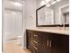 Bathroom featuring double sinks, with a tiled walk-in shower in the background at 903 Tuxworth Cir, Decatur, GA 30033