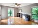 Spacious bedroom with a ceiling fan, natural light, and a dark bookshelf desk set at 903 Tuxworth Cir, Decatur, GA 30033
