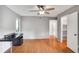 Bedroom featuring hard floors, a closet and two windows with a ceiling fan at 903 Tuxworth Cir, Decatur, GA 30033