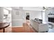 Open-concept living room with hardwood floors, leading to the kitchen and bedroom at 903 Tuxworth Cir, Decatur, GA 30033