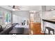 Bright living room with a fireplace, ceiling fan, and access to a balcony at 903 Tuxworth Cir, Decatur, GA 30033