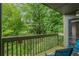 Balcony seating area offering a private outdoor space, surrounded by lush greenery at 903 Tuxworth Cir, Decatur, GA 30033
