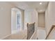 Upstairs hallway featuring carpeted floors and white walls at 132 Felicity Pike, Locust Grove, GA 30248