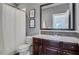 Bathroom features a white shower curtain, dark wood cabinets, and an updated vanity with a mosaic backsplash at 3467 Brookleigh Ne Ln, Atlanta, GA 30319